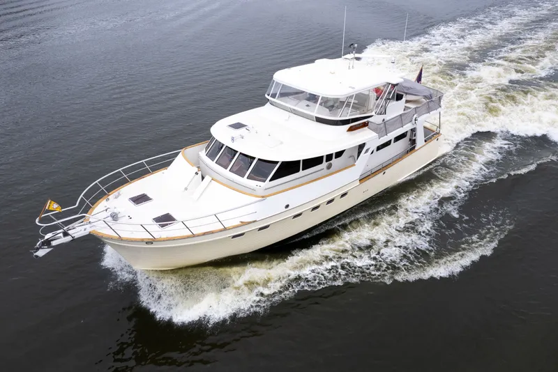 Slide: The Image of Luxury Marlow 61C yacht cruising on water, 2009 model, elegant design. - 6