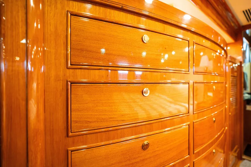 Slide: The Image of Polished wooden cabinetry on a 2009 Marlow 61C yacht interior. - 110