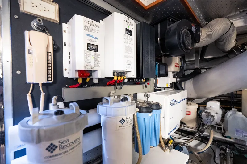 Slide: The Image of Engine room of 2009 Marlow 61C yacht with water filtration and electrical systems. - 131
