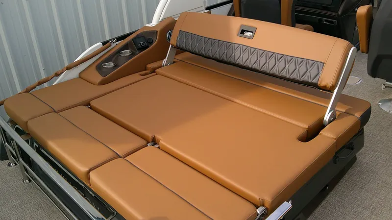 Slide: The Image of The image shows a luxurious lounging area with brown upholstery on a boat. - 18