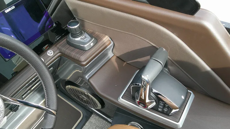 Slide: The Image of The image shows the cockpit of a 2027 Bennington 27 QXSBA with modern controls and sleek design. - 11