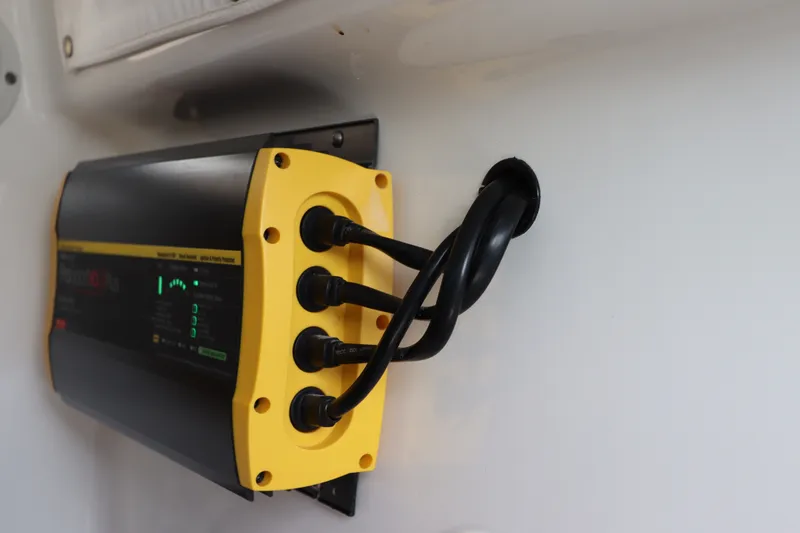 Slide: The Image of Battery charger installed on a 2021 Sea Hunt Ultra 275SE boat. - 40