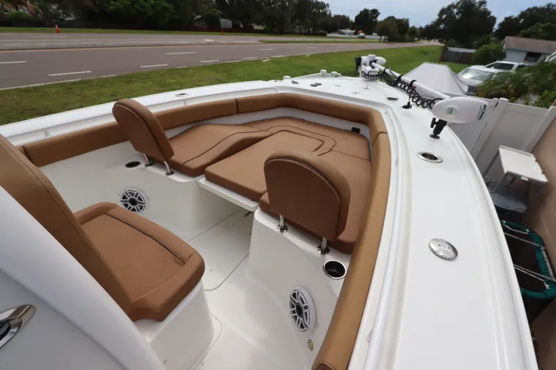 Slide: The Image of 2021 Sea Hunt Ultra 275SE boat with tan seating and modern design. - 27