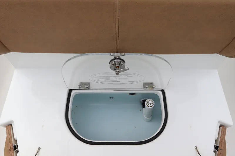 Slide: The Image of 2021 Sea Hunt Ultra 275SE boat livewell with tan seating and clear lid. - 14