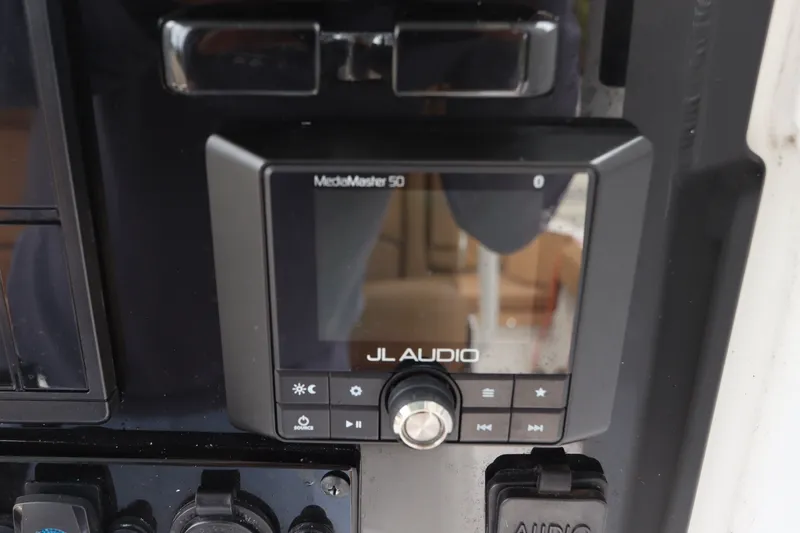Slide: The Image of JL Audio MediaMaster 50 on 2021 Sea Hunt Ultra 275SE boat dashboard. - 26