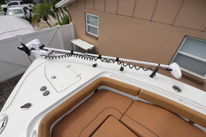 Slide: The Image of 2021 Sea Hunt Ultra 275SE boat with trolling motor and tan seating. - 32