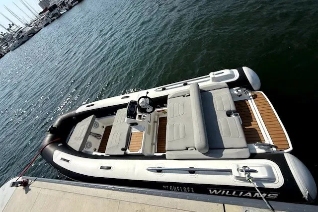 Slide: The Image of 2019 Williams Jet Tenders Sportjet 435 docked, showcasing sleek design and comfortable seating. - 1