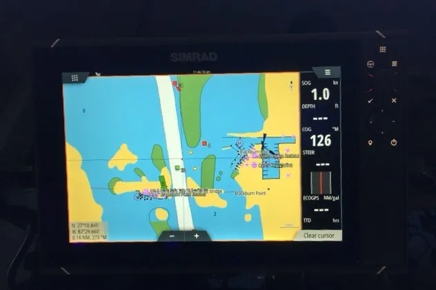 Slide: The Image of Simrad navigation display on 1985 Viking 50 Cockpit Motor Yacht, showing nautical chart and vessel data. - 19