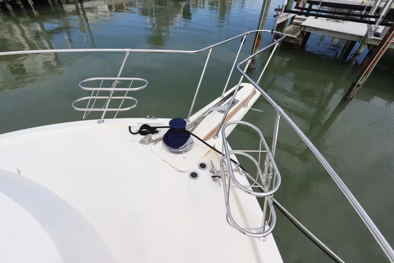 Slide: The Image of Bow view of 1985 Viking 50 Cockpit Motor Yacht at dock. - 15