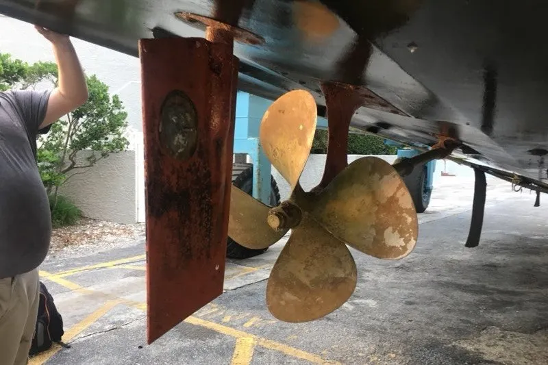 Slide: The Image of 1985 Viking 50 Cockpit Motor Yacht propeller and rudder detail. - 59