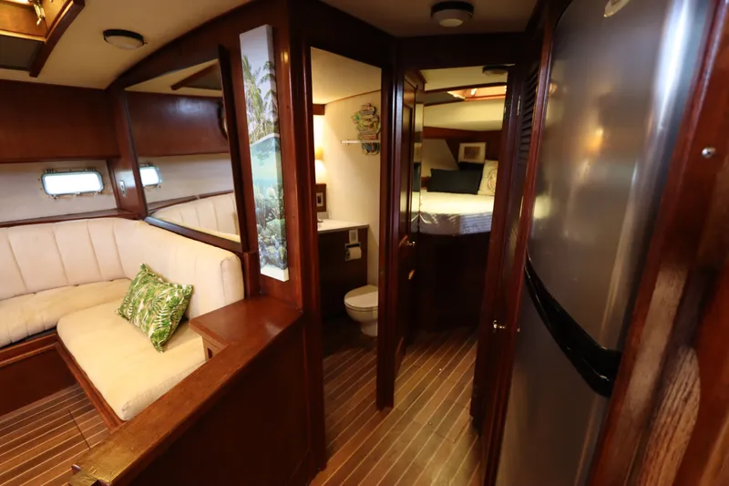 Slide: The Image of Interior of 1985 Viking 50 Cockpit Motor Yacht with cozy seating and modern amenities. - 36