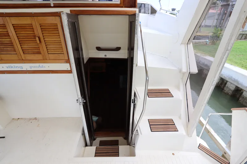 Slide: The Image of Staircase and entrance on a 1985 Viking 50 Cockpit Motor Yacht. - 22