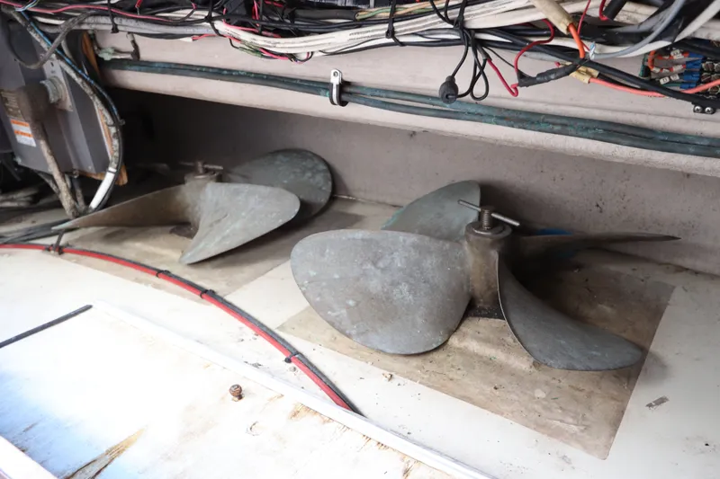 Slide: The Image of Propellers of a 1985 Viking 50 Cockpit Motor Yacht in storage compartment. - 60