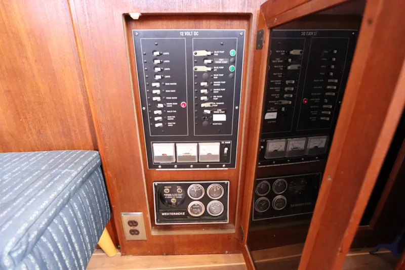 Slide: The Image of Electrical panel on a 1985 Viking 50 Cockpit Motor Yacht, featuring switches and gauges. - 53
