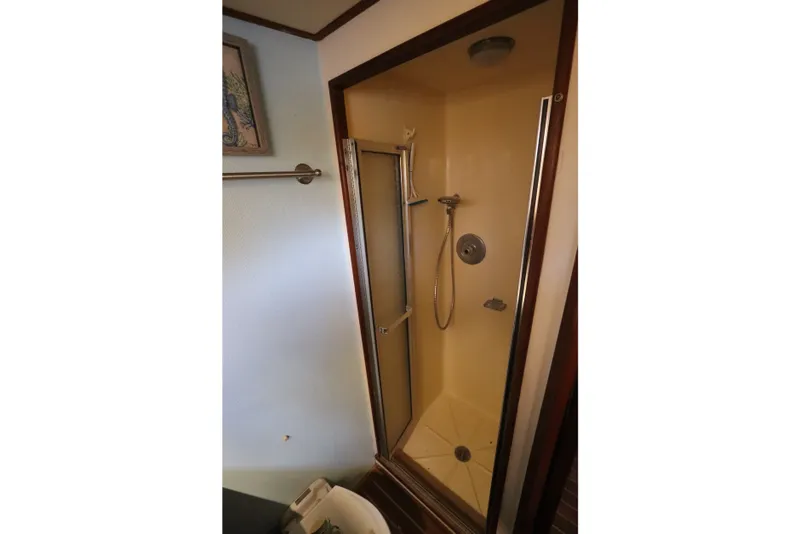 Slide: The Image of Shower area in 1985 Viking 50 Cockpit Motor Yacht, featuring a compact design. - 52