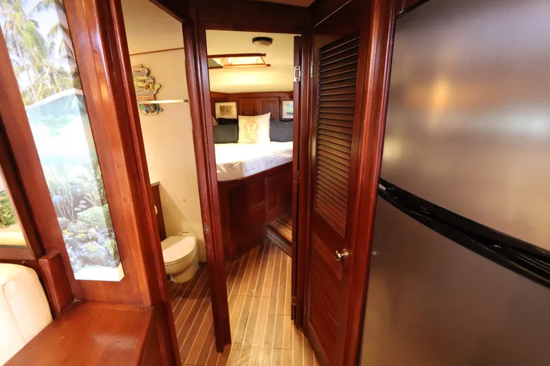 Slide: The Image of Interior of 1985 Viking 50 Cockpit Motor Yacht with wood finishes and modern amenities. - 38