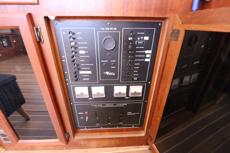 Slide: The Image of Electrical panel on a 1985 Viking 50 Cockpit Motor Yacht, featuring various switches and controls. - 55