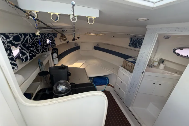 Slide: The Image of Interior of 2003 Stamas 290 Express boat with cozy cabin and kitchenette. - 15