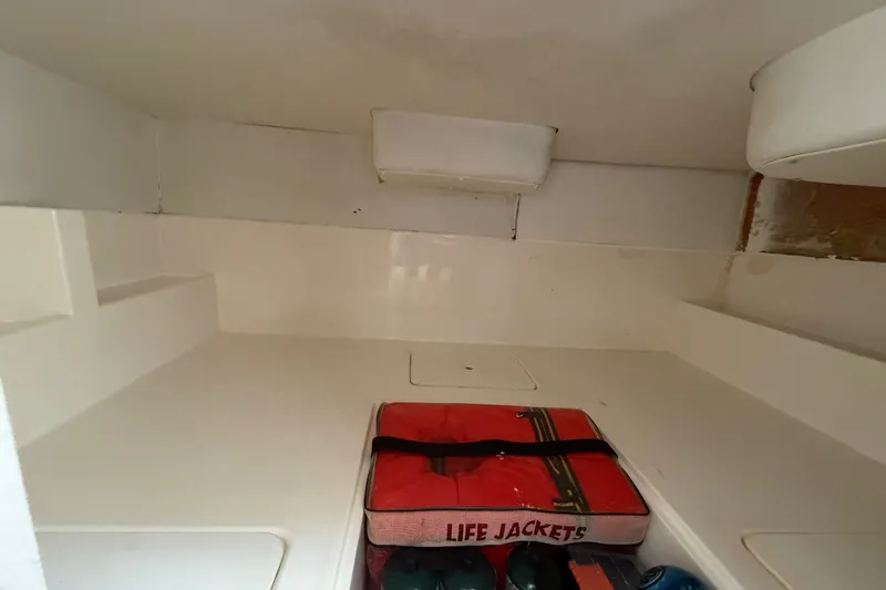 Slide: The Image of Interior cabin of 2003 Stamas 290 Express with life jackets stored neatly. - 20