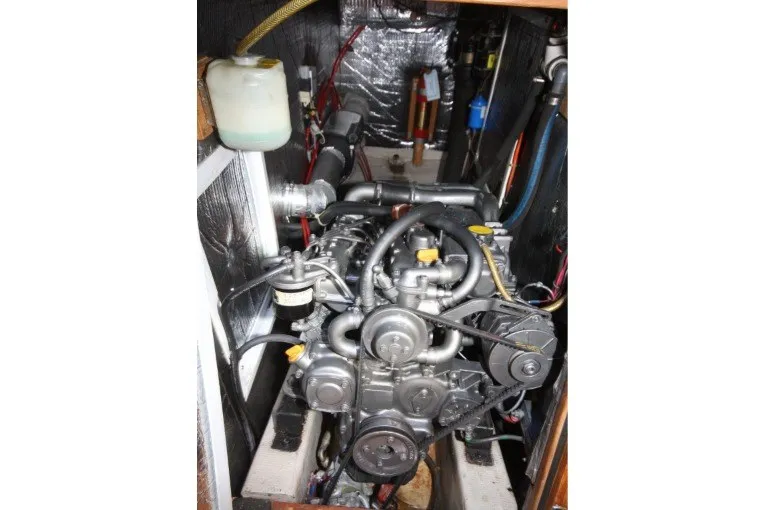 Slide: The Image of Engine compartment of a 1988 Sceptre 41 boat, showcasing mechanical components and wiring. - 20