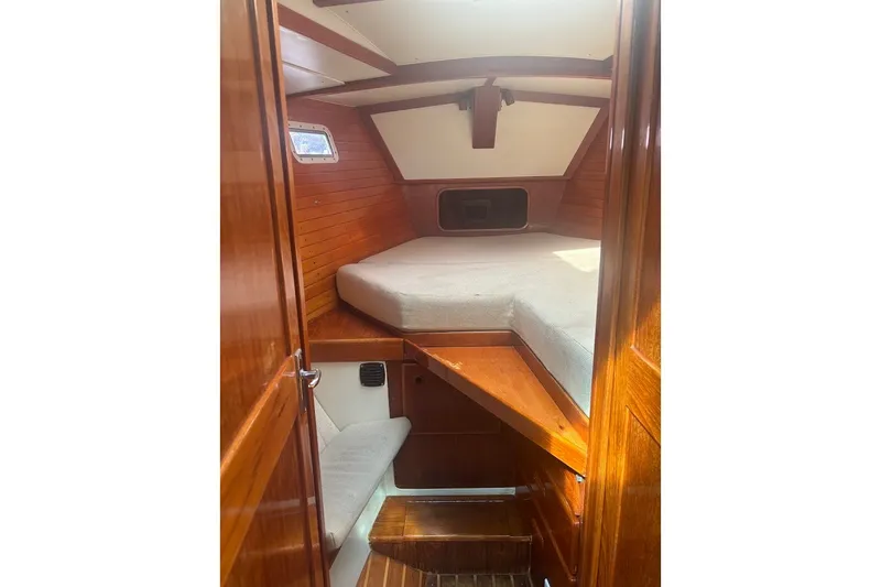 Slide: The Image of Cozy cabin interior of 1988 Sceptre 41 yacht with wooden finish and cushioned bed. - 14