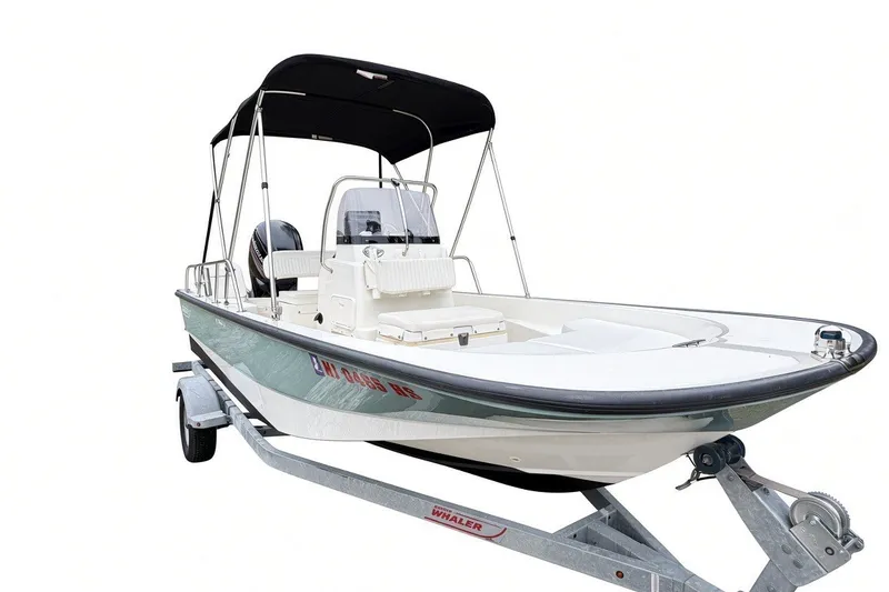 Slide: The Image of 2017 Boston Whaler 170 Montauk boat on trailer with canopy, side view. - 3