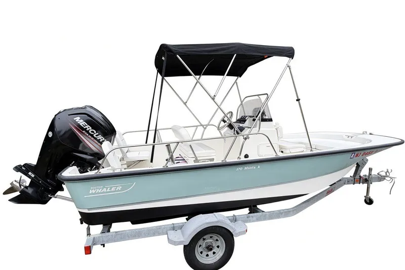 Slide: The Image of 2017 Boston Whaler 170 Montauk boat on trailer with Mercury outboard engine. - 2