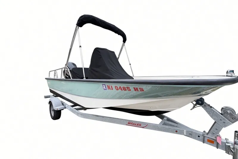 Slide: The Image of 2017 Boston Whaler 170 Montauk boat on trailer with cover and bimini top. - 27