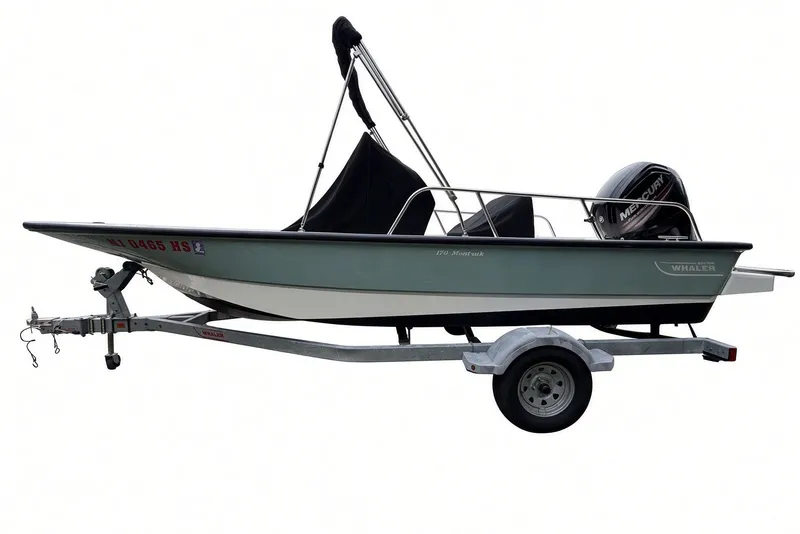 Slide: The Image of 2017 Boston Whaler 170 Montauk boat on trailer with Mercury engine. - 29