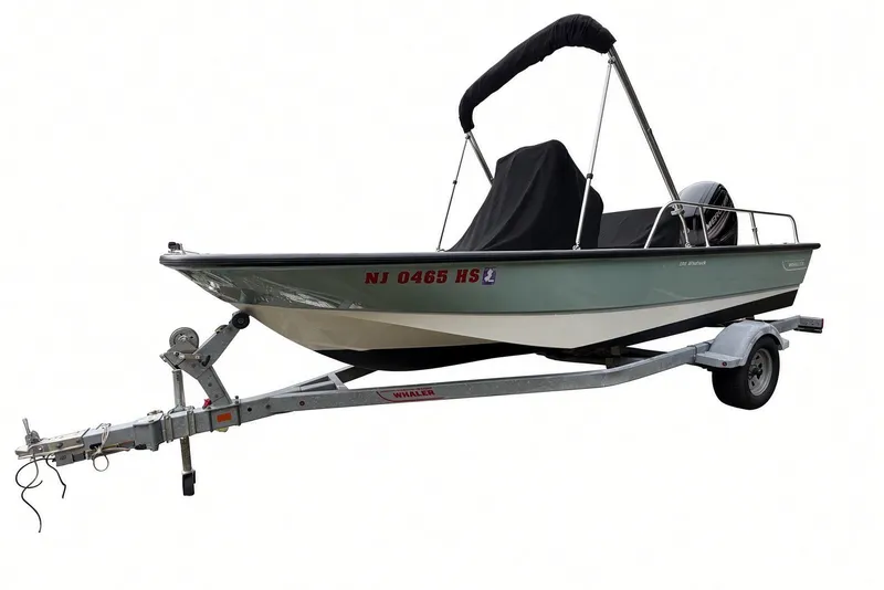 Slide: The Image of 2017 Boston Whaler 170 Montauk boat on trailer with cover and bimini top. - 28