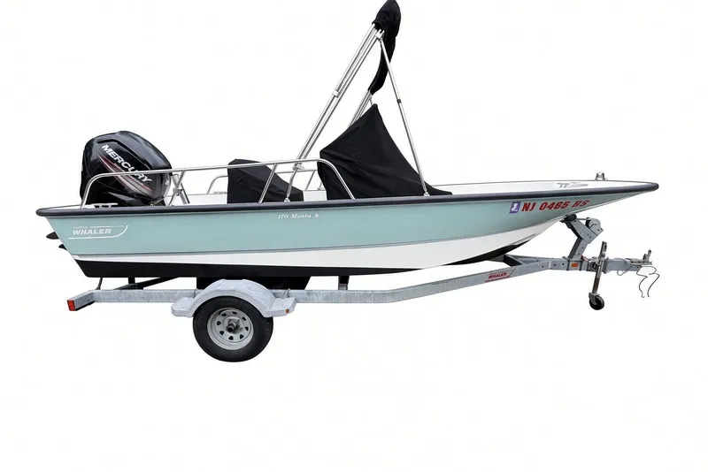 Slide: The Image of 2017 Boston Whaler 170 Montauk boat on trailer with Mercury outboard engine. - 26