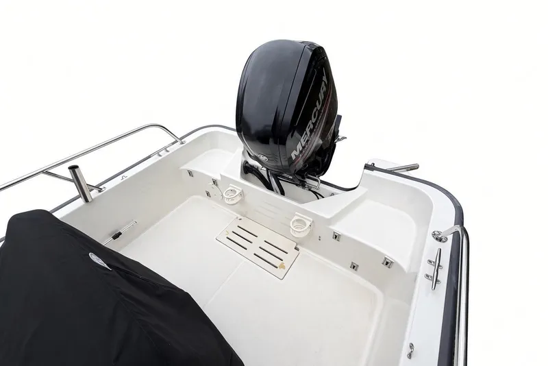 Slide: The Image of 2017 Boston Whaler 170 Montauk boat with Mercury outboard motor, rear deck view. - 20