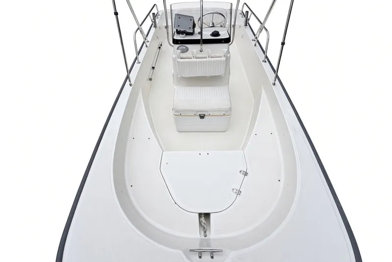 Slide: The Image of 2017 Boston Whaler 170 Montauk boat interior, featuring seating and console. - 17