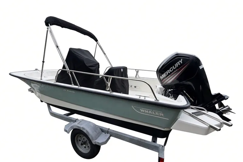 Slide: The Image of 2017 Boston Whaler 170 Montauk boat with Mercury engine on trailer. - 31