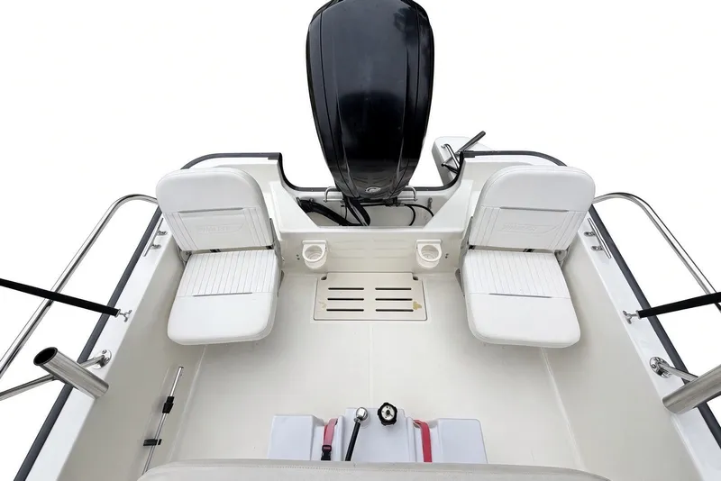 Slide: The Image of 2017 Boston Whaler 170 Montauk boat interior with seating and motor, top view. - 14