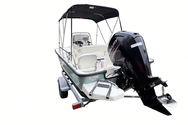 Slide: The Image of 2017 Boston Whaler 170 Montauk boat with Mercury outboard motor and trailer. - 8