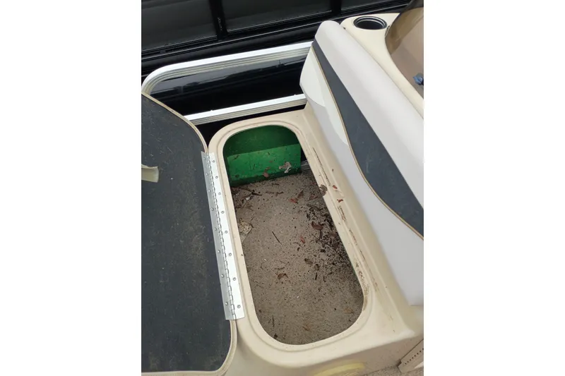 Slide: The Image of Open storage compartment on 2011 Bennington 24 SFi boat, showing interior space. - 14