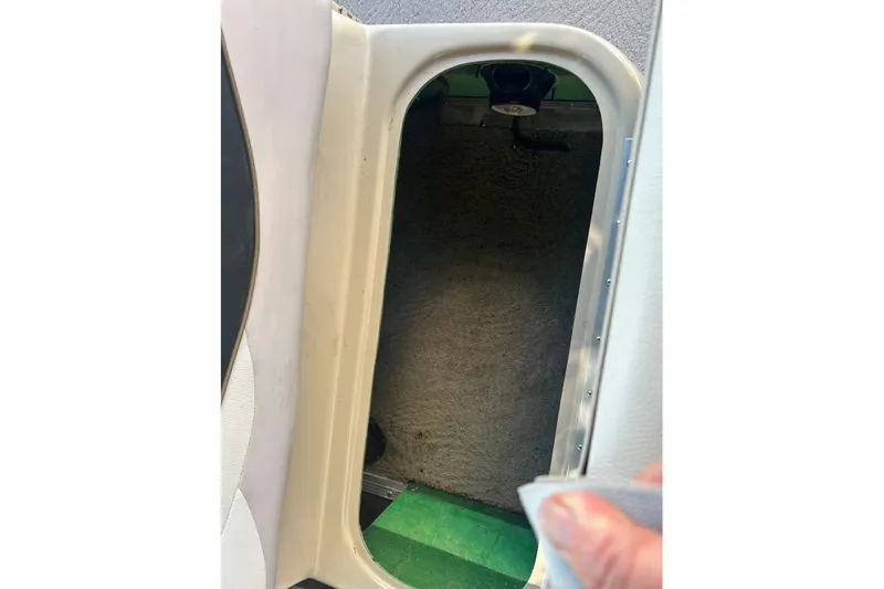 Slide: The Image of Interior storage compartment of a 2011 Bennington 24 SFi boat. - 21
