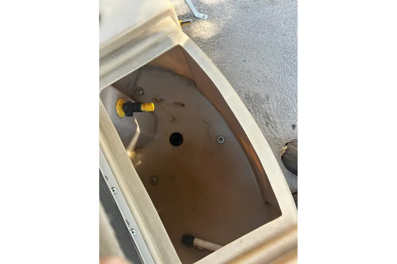 Slide: The Image of Open compartment in 2011 Bennington 24 SFi boat, showing interior details and fittings. - 5