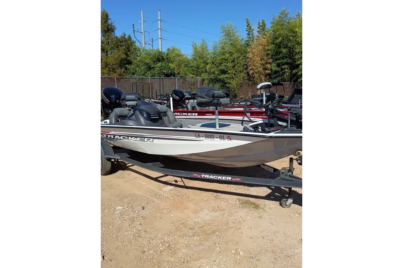 The Image of 2021 Tracker Pro Team 175 TXW Tournament Edition boat on trailer, parked outdoors. - 0