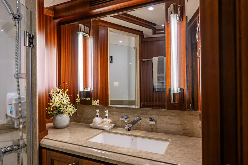 Slide: The Image of Luxurious bathroom on 2012 Ocean Alexander 85 E yacht with elegant wood accents. - 57