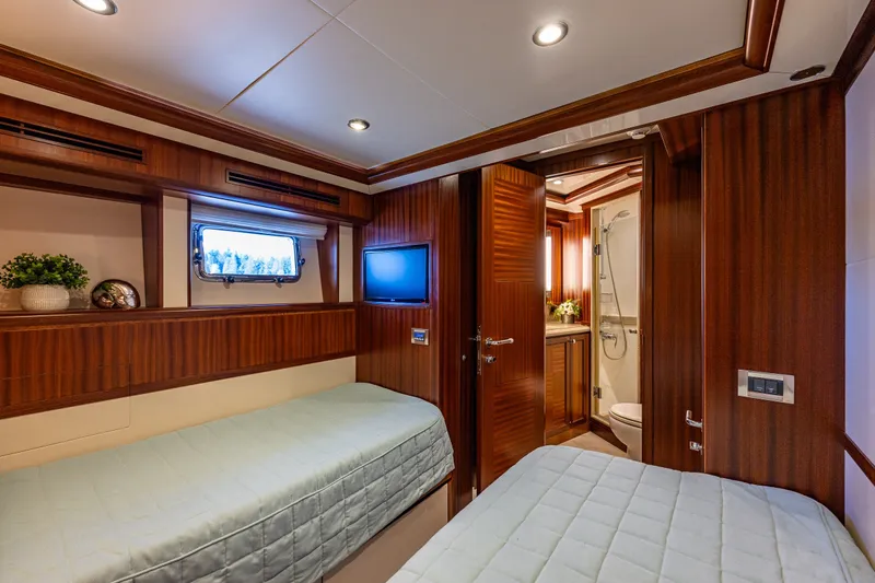 Slide: The Image of Luxurious cabin interior of 2012 Ocean Alexander 85 E yacht with twin beds and ensuite bathroom. - 56