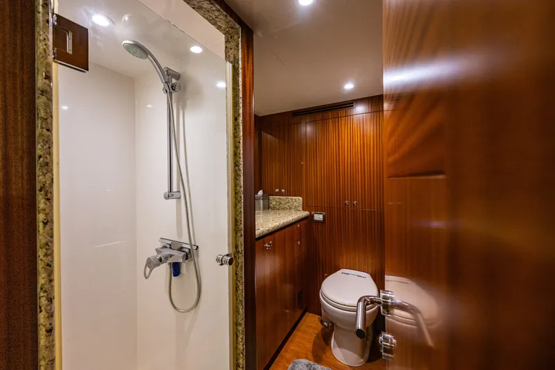 Slide: The Image of Luxurious bathroom in 2012 Ocean Alexander 85 E yacht with shower and wooden cabinetry. - 64