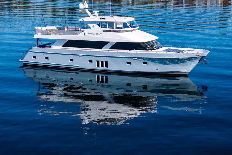 Slide: The Image of Luxurious 2012 Ocean Alexander 85 E yacht reflecting on calm blue water. - 13