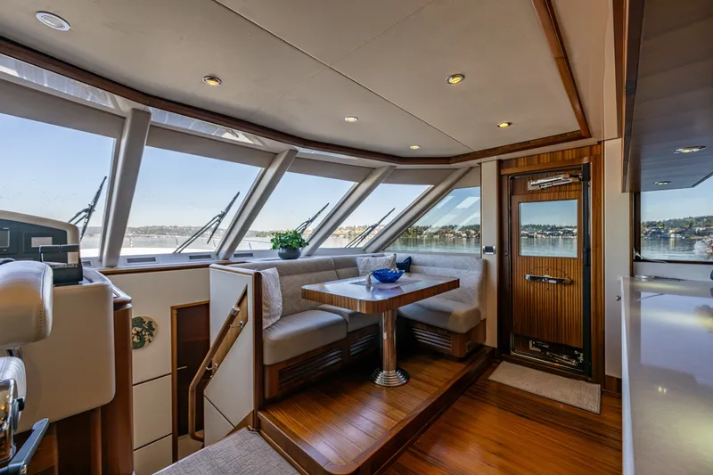 Slide: The Image of Luxurious interior of 2012 Ocean Alexander 85 E yacht with panoramic windows and elegant seating. - 82