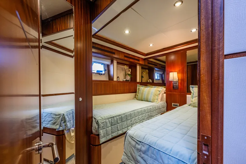 Slide: The Image of Luxurious cabin interior of 2012 Ocean Alexander 85 E yacht with twin beds. - 52