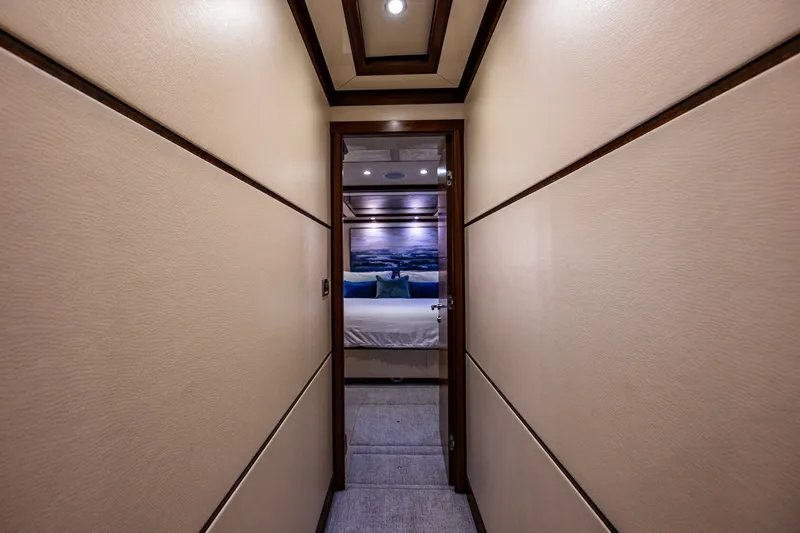 Slide: The Image of Hallway leading to a luxurious bedroom on a 2012 Ocean Alexander 85 E yacht. - 45