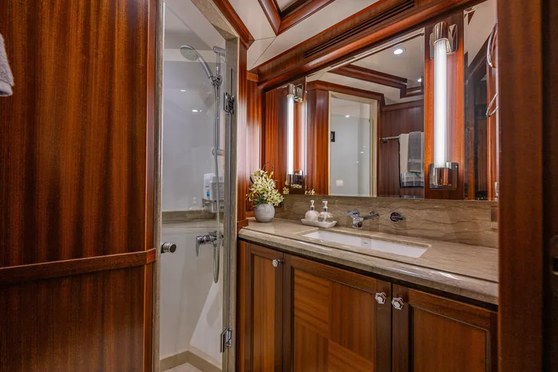 Slide: The Image of Luxurious bathroom in 2012 Ocean Alexander 85 E yacht with wood accents and modern fixtures. - 46