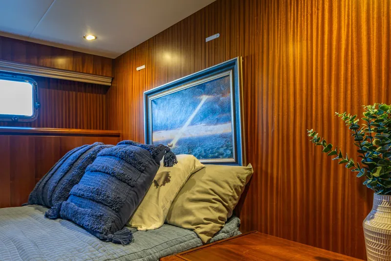 Slide: The Image of Luxurious cabin interior of 2012 Ocean Alexander 85 E yacht with cozy bedding and artwork. - 97