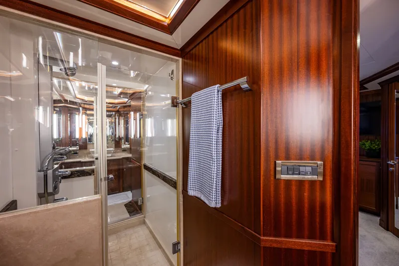 Slide: The Image of Luxurious bathroom interior on 2012 Ocean Alexander 85 E yacht, featuring elegant wood paneling. - 42